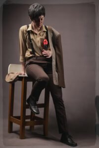 Gillian as Jean Claude looking at a rose