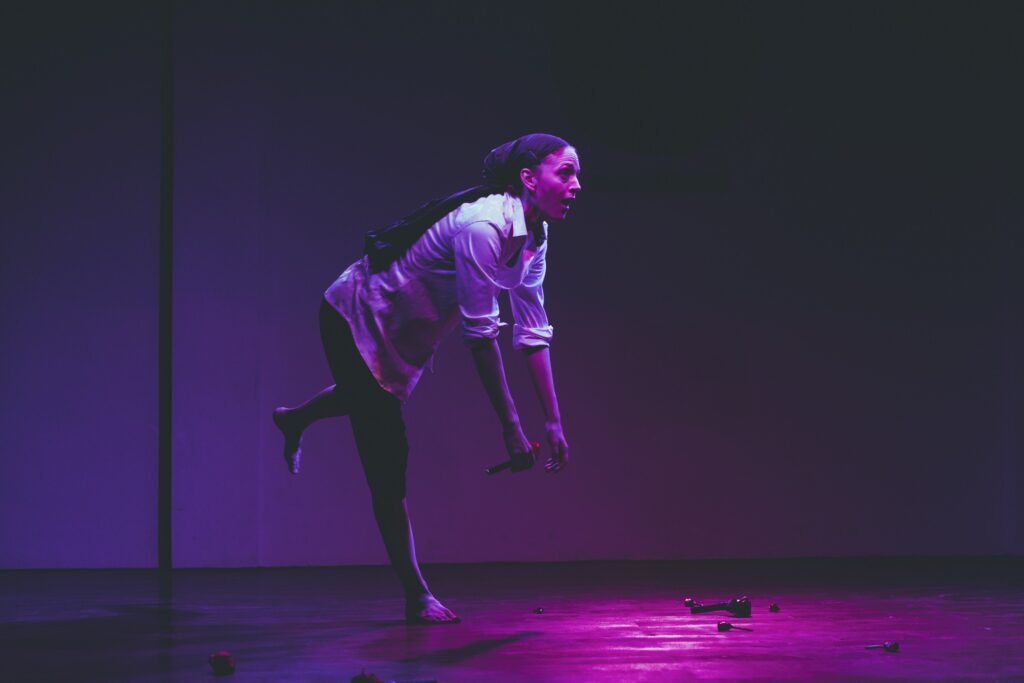 Gillian as Pierrot with mouth open facing to the right and bent forward