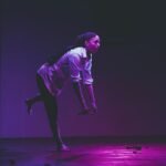Gillian as Pierrot with mouth open facing to the right and bent forward